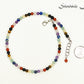 4mm Chakra Gemstone Choker Necklace beside a dime.