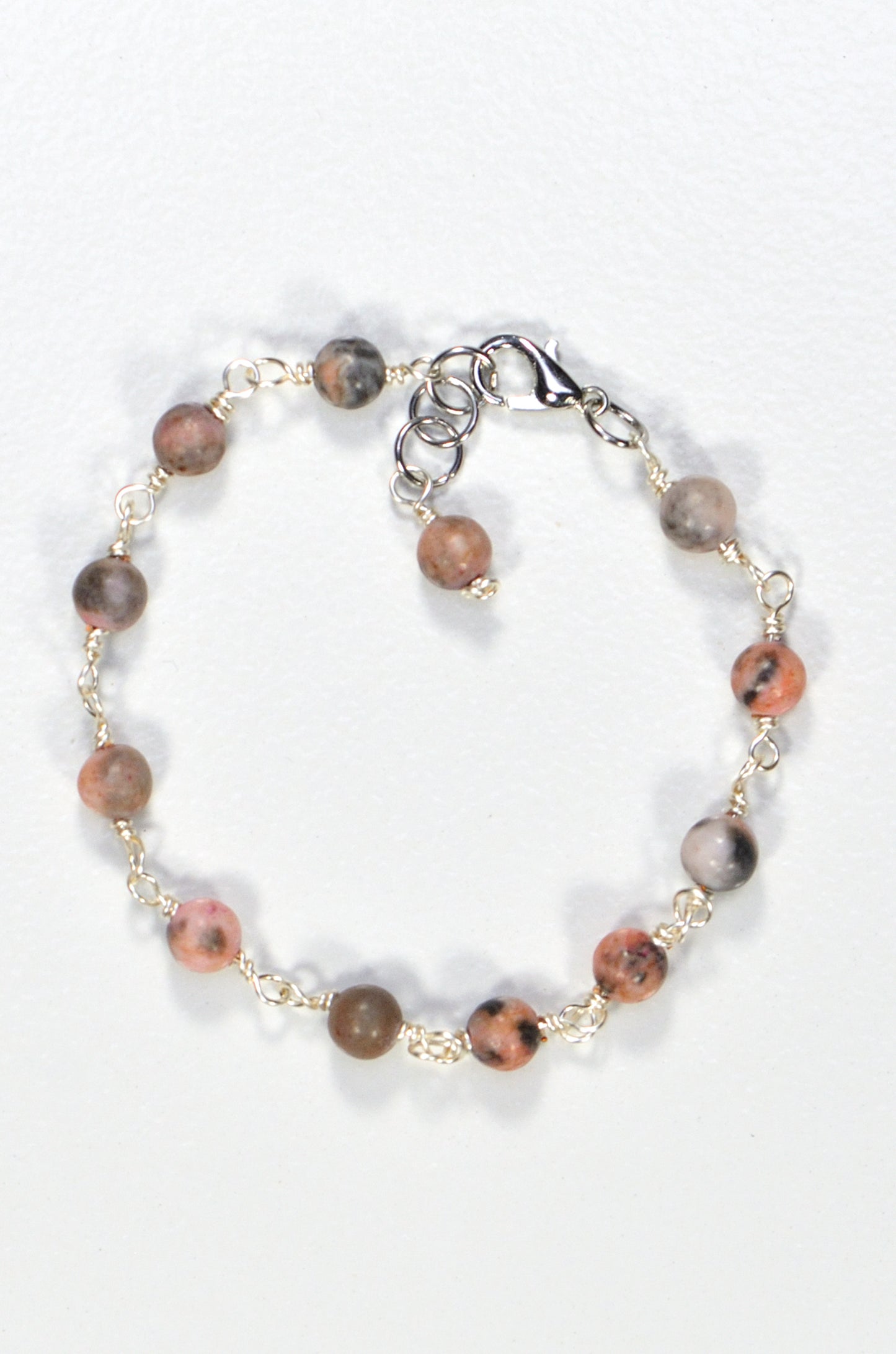 Top view of 6mm Pink Zebra Jasper Link Bracelet.