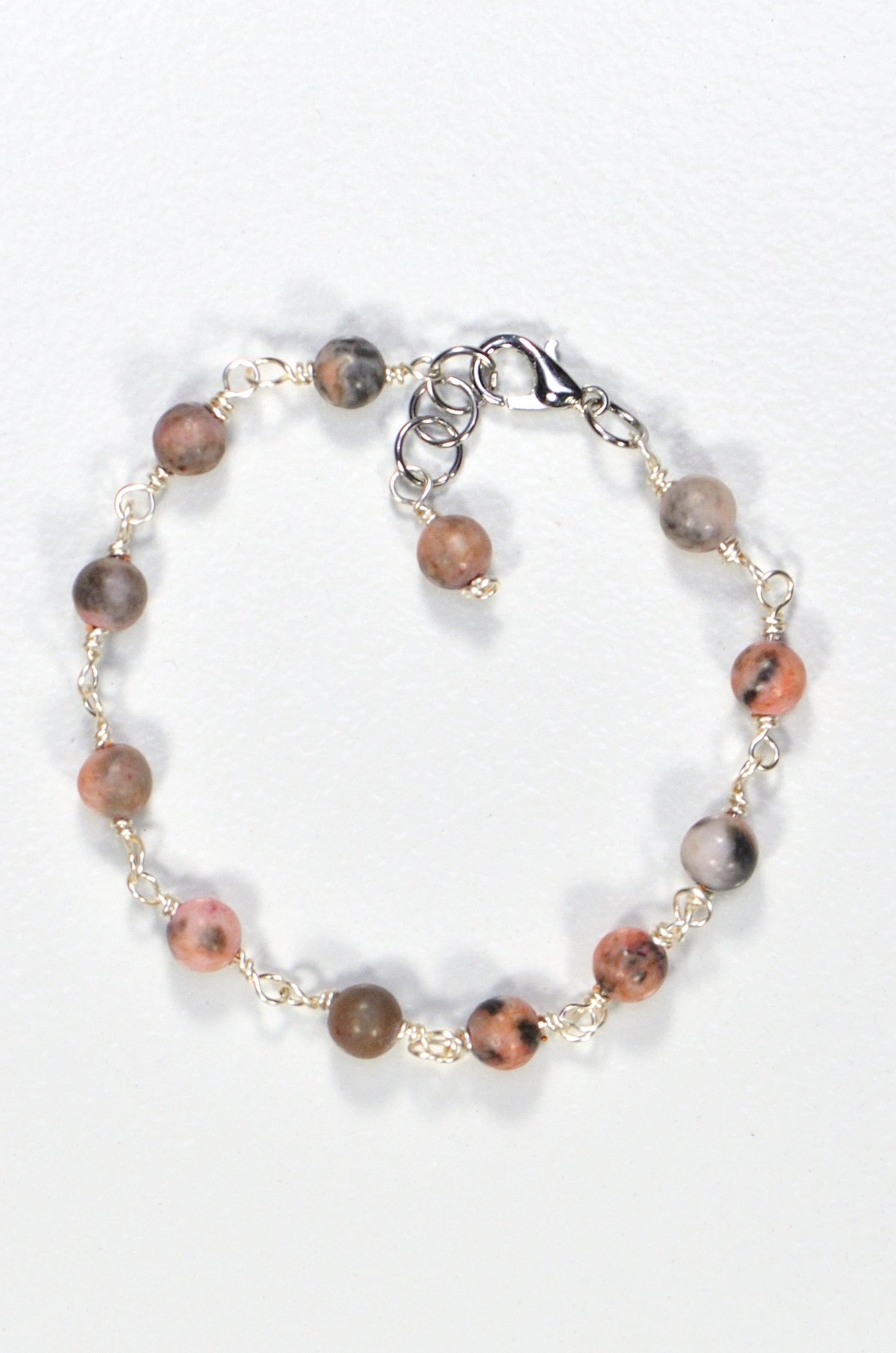 Top view of 6mm Pink Zebra Jasper Link Bracelet.