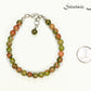 6mm Unakite Jasper Beaded Bracelet beside a dime.