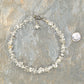Clear Quartz Crystal Chip Choker Necklace beside a dime.