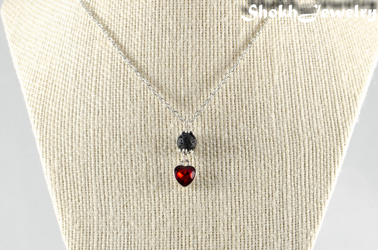 Lava Rock and Heart Shaped January Birthstone Choker Necklace displayed on a bust.