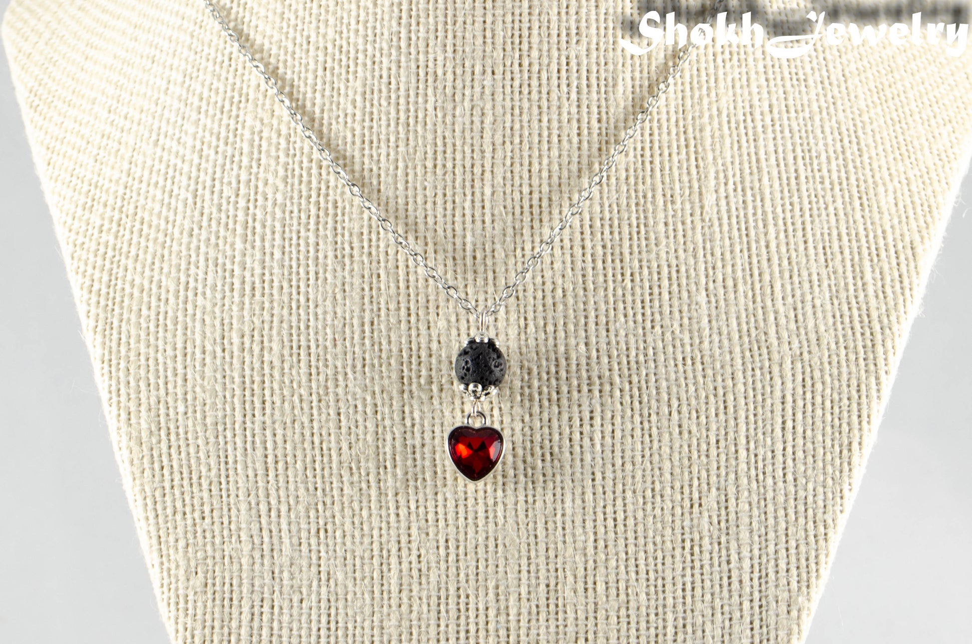 Lava Rock and Heart Shaped January Birthstone Choker Necklace displayed on a bust.