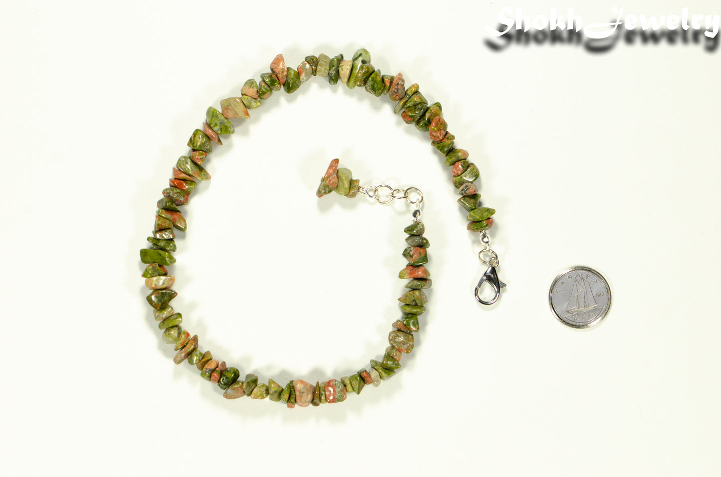 Natural Unakite Crystal Chip Choker Necklace beside a dime.