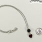 Lava Rock and Heart Shaped January Birthstone Choker Necklace beside a dime.