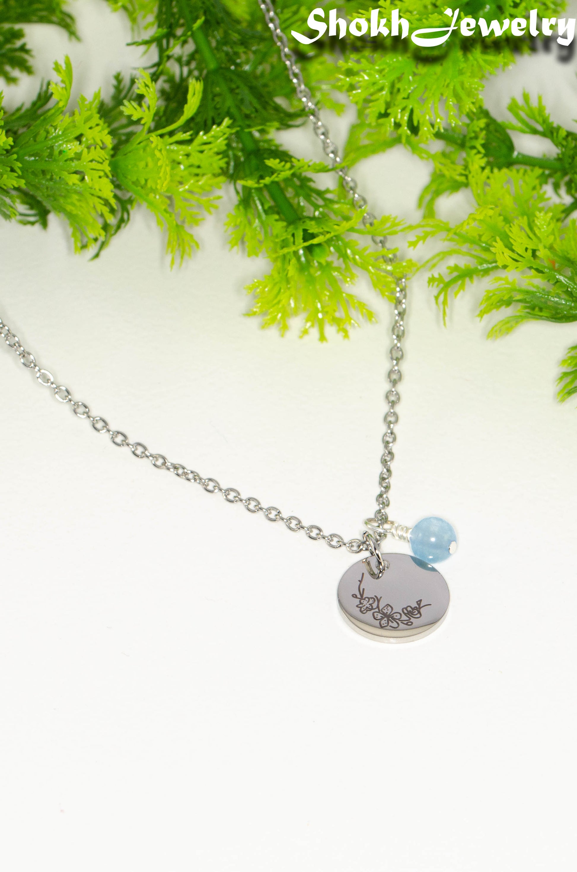 March Birth Flower Necklace with Aquamarine Birthstone Pendant.