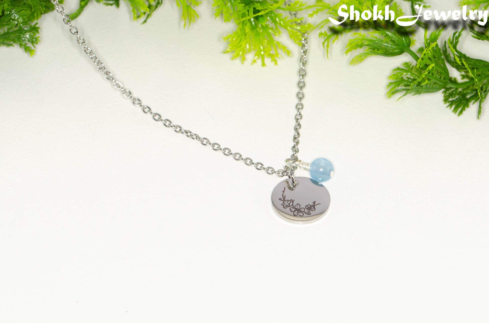 March Birth Flower Necklace with Aquamarine Birthstone Pendant.