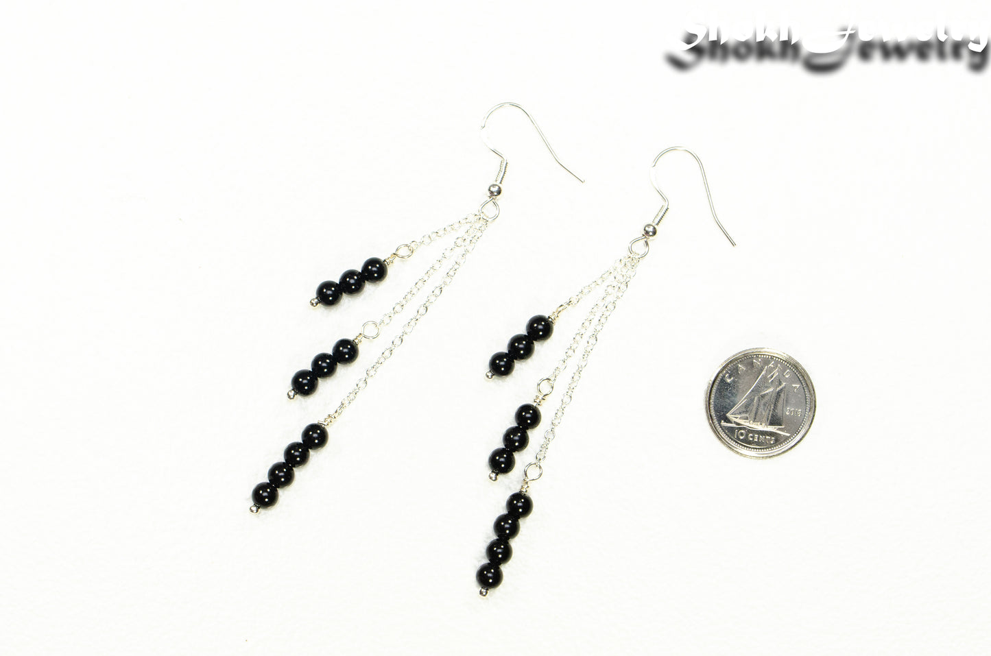 Silver Plated Chain and Black Obsidian Crystal Earrings beside a dime.