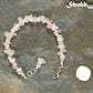 Natural Rose Quartz Crystal Chip Bracelet beside a dime.