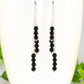 Close up of Silver Plated Chain and Black Obsidian Crystal Earrings.