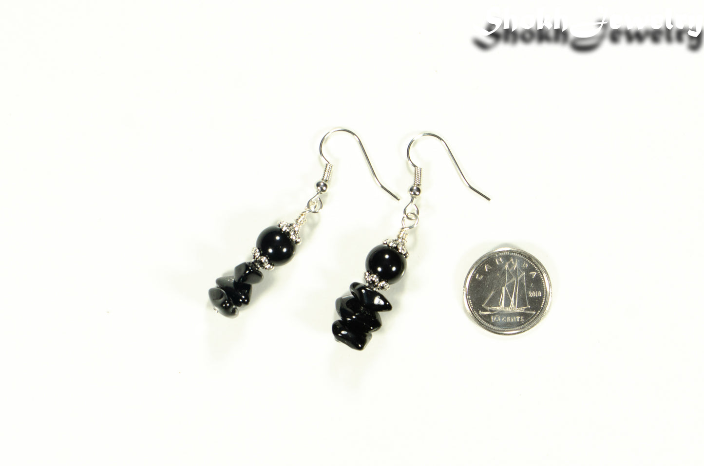 Simple  Black Obsidian Crystal Chip Earrings beside a dime.