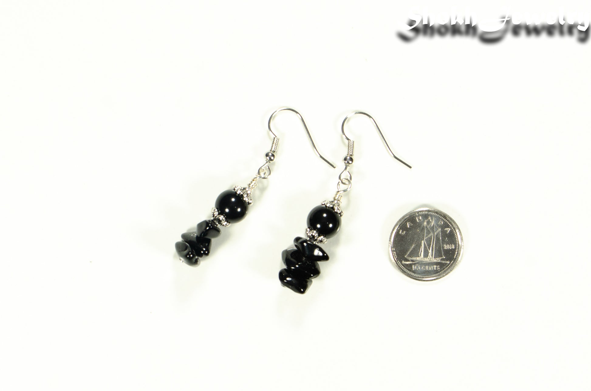Simple  Black Obsidian Crystal Chip Earrings beside a dime.