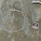 Silver Plated Dainty Chain Bracelet beside a dime.