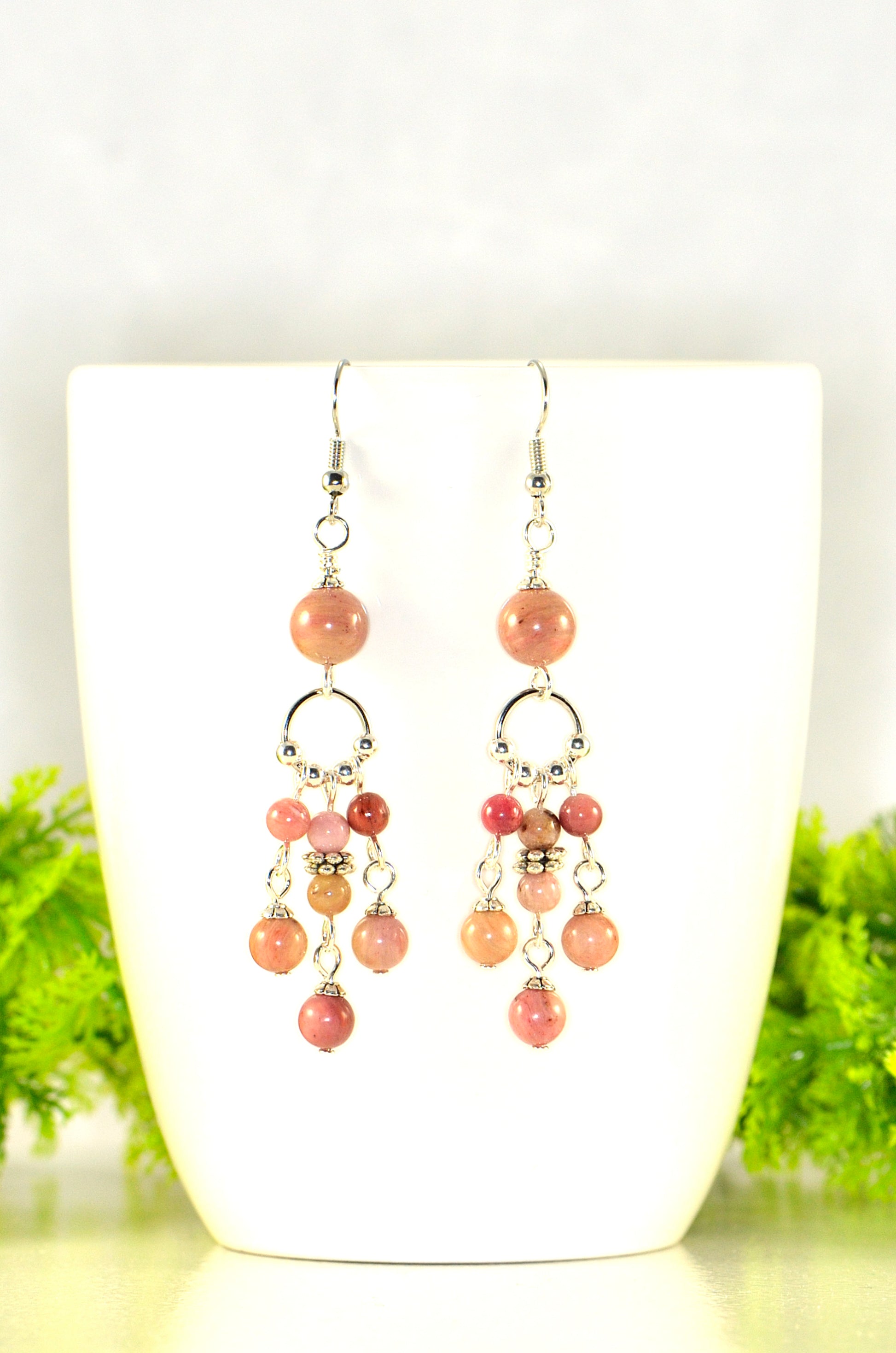 Close up of Statement Pink Rhodonite Chandelier Earrings.