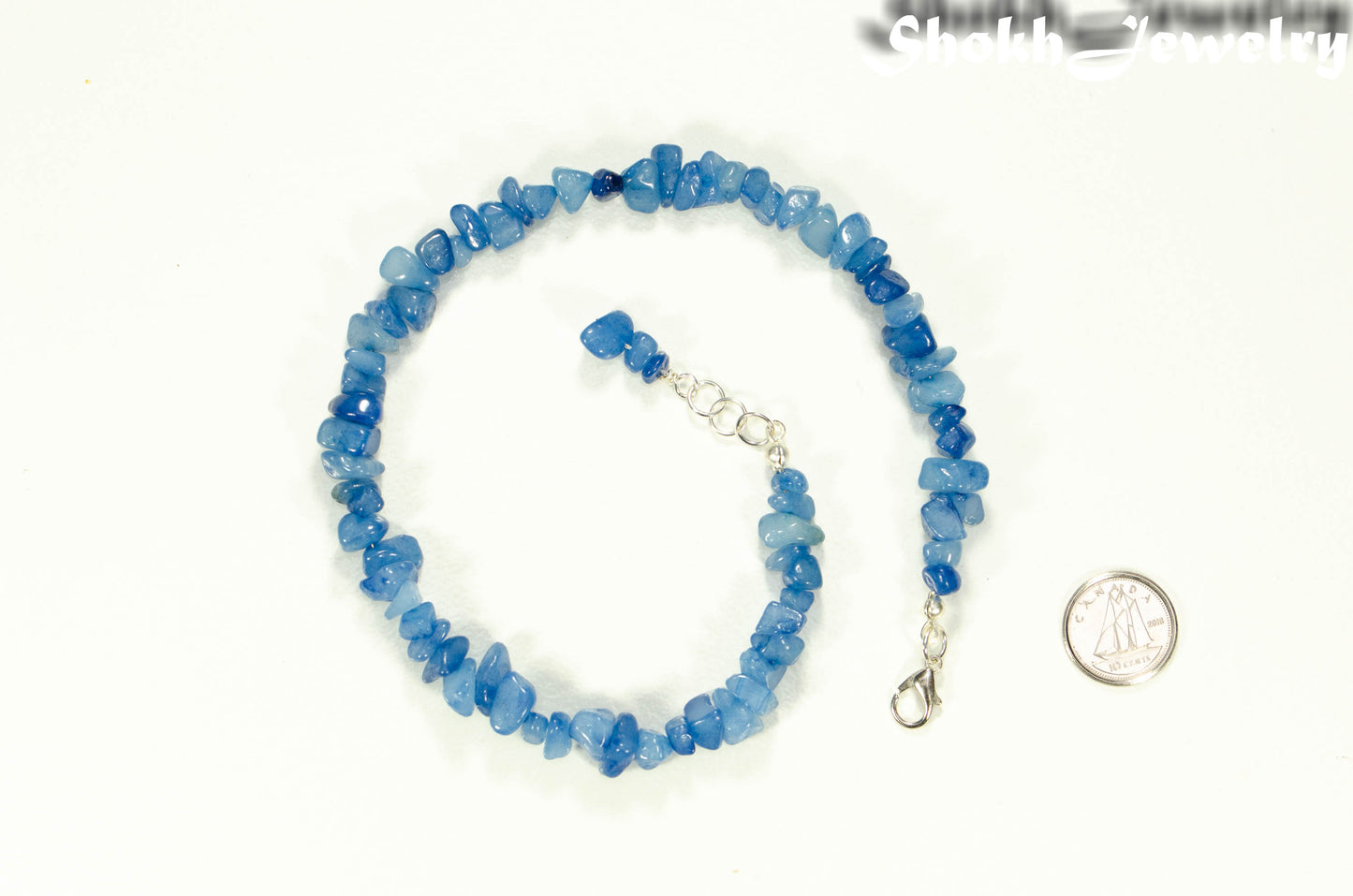 Natural Blue Quartzite Crystal Chip Anklet beside a dime.