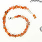 Natural Carnelian Crystal Chip Choker Necklace beside a dime