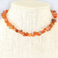 Natural Carnelian Crystal Chip Choker Necklace displayed on a bust